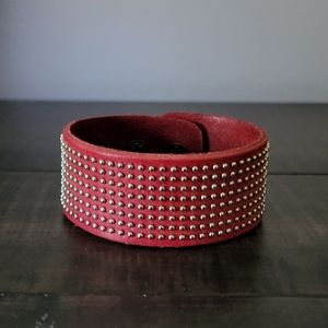 Red leather wrist cuff with silver studding